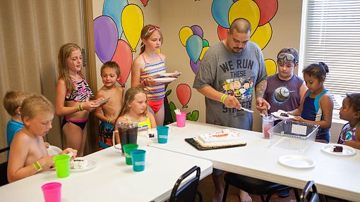 Water-Zoo Clinton children's birthday party Children waiting for the cake to be cut during birthday part at the Water-Zoo