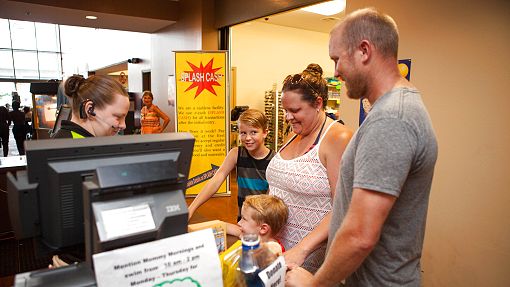 Daily Tickets Purchase at Water-Zoo indoor water park Clinton, Oklahoma Young family purchasing tickets at the front counter at Water-Zoo indoor water park in Clinton, Oklahoma
