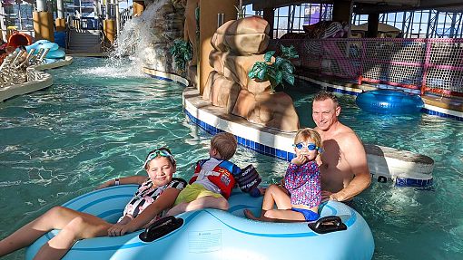 Children and father in Lazy River at Water-Zoo Indoor Water Park in Clinton, Oklahoma Children and father in Lazy River at Water-Zoo Indoor Water Park in Clinton, Oklahoma