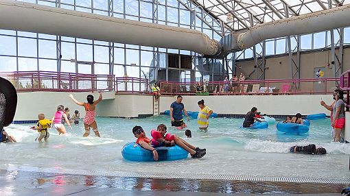 Parents and kids in Wave-Pool at Water-Zoo Indoor Water Park in Clinton, Oklahoma